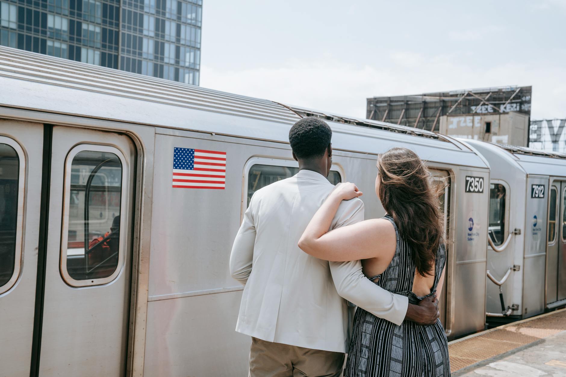 back view of man and woman standing close together